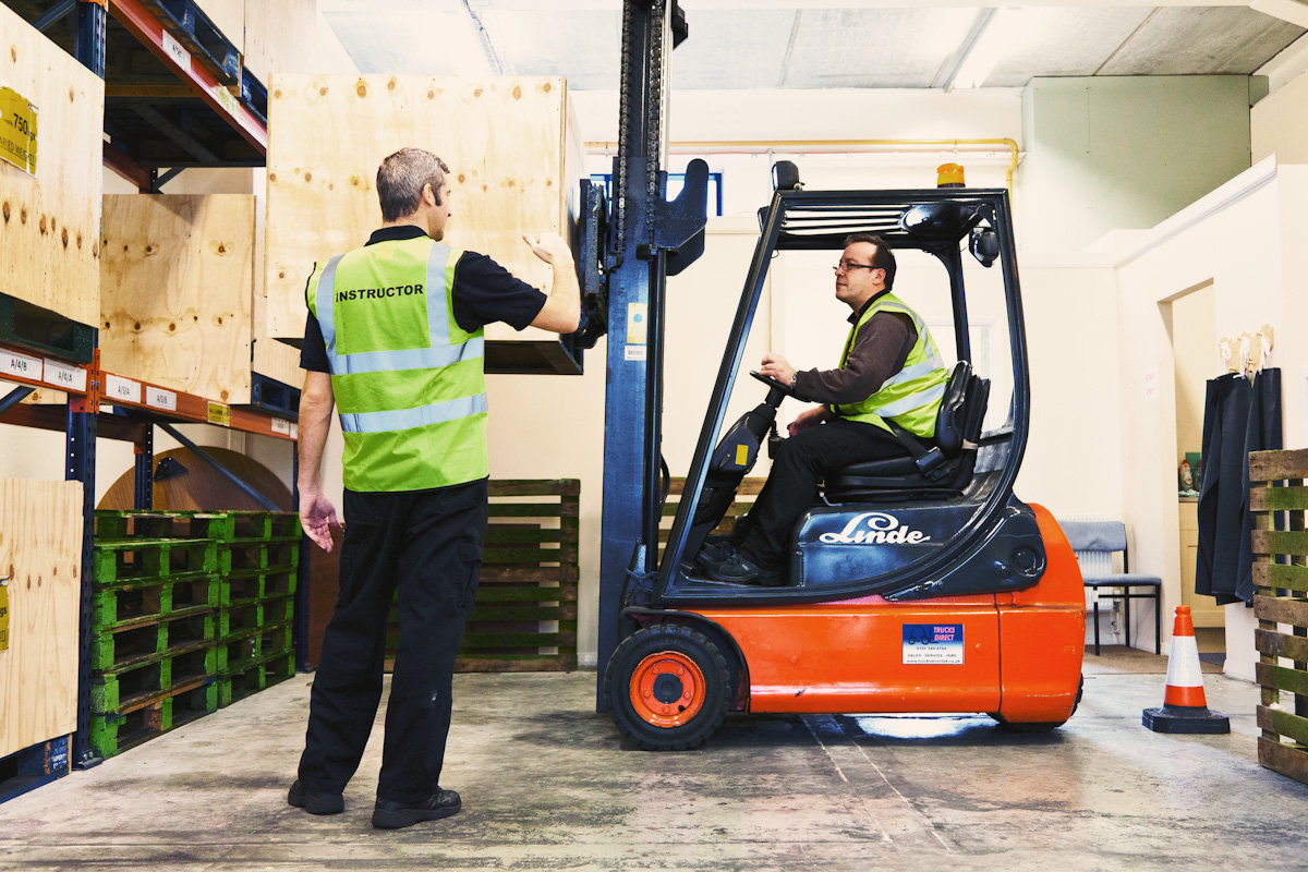 Trainee driving a counterbalance forklift truck